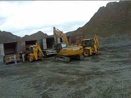 Excavators and loaders at the mine site
